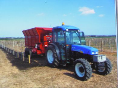 Spreading compost in an Apple orchard