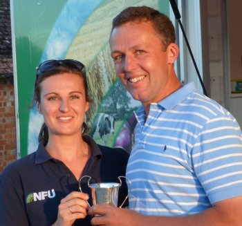 Hayley Campbell-Gibbons presents Nick Overy with the Bayer UK Trophy	trophy for third place in the overall competition