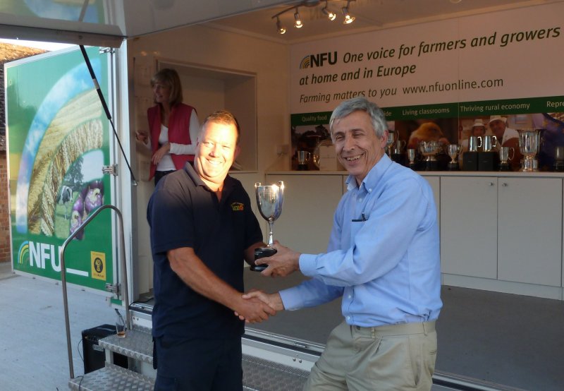 The BASF Championship Trophy for 'Overall Winner' is presented to George Chambers by Simon Townsend of BASF.