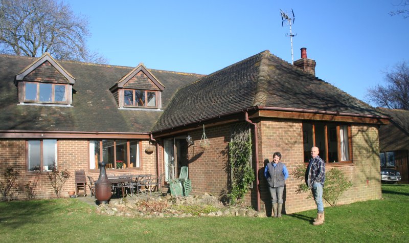 Andrew and Alayne in front of their Farmhouse