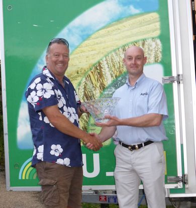 George Chambers receives the AGRII Trophy from Brendan Rhodes