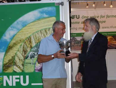 James Hasell receives the N.P.Seymour Trophy from Nick Seymour