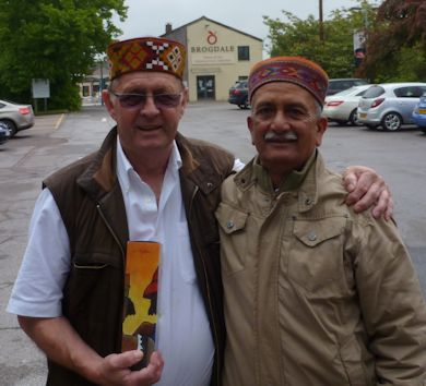 The English Apple Man & The Himalayan Apple Man in traditional Himalayan headwear