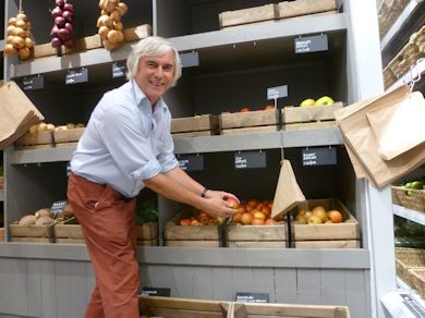 Chris Levett attending to the apples in the produce display