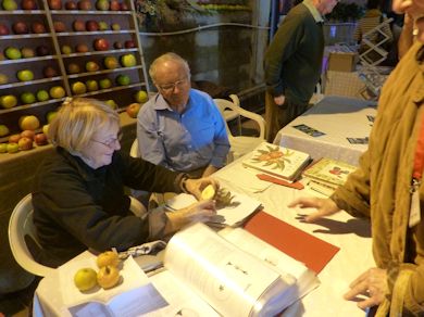 Joan Morgan and Brian Self identify apples for visitors