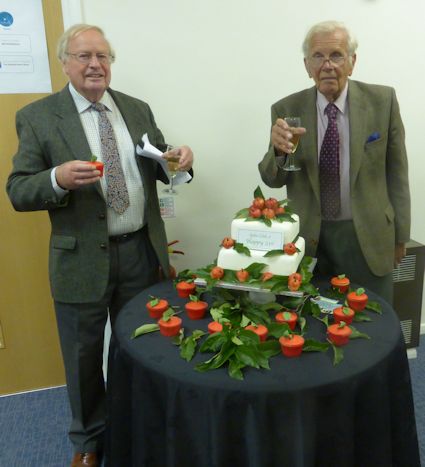 Harry Wooldridge and Roger Worraker pose with the Birthday cake