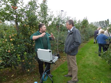 Adrian Harris discusses the LIDAR machine with Tim Biddlecombe of FAST